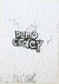 Gilbert van Drunen, ''Democracy'', 2009, potlood op papier, A4; het verfrummelde papier 'democracy' is weer ontvouwd, ingelijst. 3/10 UNICUM
PHŒBUS•Rotterdam