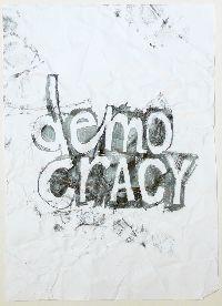 Gilbert van Drunen, ''Democracy'', 2009, potlood op papier, A4; het verfrummelde papier 'democracy' is weer ontvouwd, ingelijst. 7/10 UNICUM
PHŒBUS•Rotterdam
