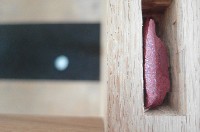 Thomas I'Anson & Cathérine Lommée, Baucis and Philemon, 2018, detail table made from linden, oak, Kilkenny limestone, green dolomite, cinnabar and cassiterite - this photo shows a part of Kilnenny stone and inserted gemstone
PHŒBUS•Rotterdam