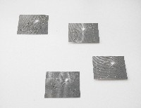 Regula Maria Müller, vier bewerkte foto's [Firefly], 2017, foto van weefsel van zeewier en Japans papier 0,2 mm., gelaserd; daarna met metalen en glaskralen bewerkt; elk 20 x 26 cm.
PHŒBUS•Rotterdam