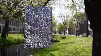 Jan Smejkal places a textwork hanging in a tree above the water, just across the gallery,

on the Eendrachtsweg/Westersingel.
PHŒBUS•Rotterdam